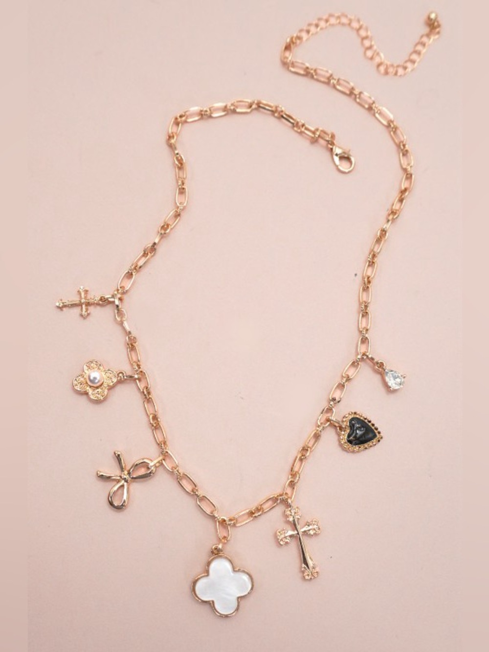 JOSSLYN by Wall to Wall Gold Charm Necklace with Clover Bow Cross Heart Flower